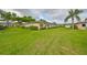 Well-maintained home with a manicured lawn and beautiful landscaping, offering great curb appeal at 1417 Langley Dr, Sun City Center, FL 33573