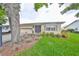 Well-maintained home featuring an attached garage, manicured lawn, and inviting curb appeal in a serene neighborhood at 1417 Langley Dr, Sun City Center, FL 33573