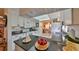 Well-lit kitchen boasts sleek granite countertops and updated appliances, offering a stylish cooking experience at 1417 Langley Dr, Sun City Center, FL 33573