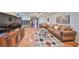 Open-concept living room with wood floors, neutral tones, and ample space for entertaining at 1417 Langley Dr, Sun City Center, FL 33573