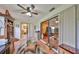 Cozy sitting room featuring comfortable furniture, an area rug, and lots of bright, natural light at 1417 Langley Dr, Sun City Center, FL 33573