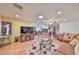 Bright and spacious living room with wood floors, ceiling fans, and open layout at 1417 Langley Dr, Sun City Center, FL 33573
