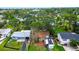 Aerial view capturing the home, its landscaping, and the street at 1726 Massachusetts Ne Ave, St Petersburg, FL 33703