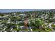 Stunning aerial view showcases waterfront community with lush green landscaping and tranquil waters at 1726 Massachusetts Ne Ave, St Petersburg, FL 33703