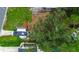 An aerial view of the home's roof and surrounding landscaping with mature trees at 1726 Massachusetts Ne Ave, St Petersburg, FL 33703