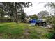 Backyard with above ground pool, deck, and four wheeler at 1726 Massachusetts Ne Ave, St Petersburg, FL 33703