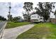 Exterior view of the home featuring a driveway and RV at 1726 Massachusetts Ne Ave, St Petersburg, FL 33703