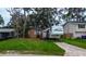 Inviting front yard featuring a well-kept lawn and a home with classic design at 1726 Massachusetts Ne Ave, St Petersburg, FL 33703