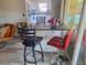 Eat-in kitchen with dark countertop and bar stool seating next to sliding glass doors at 1726 Massachusetts Ne Ave, St Petersburg, FL 33703