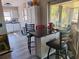 Eat-in kitchen with dark countertop and bar stool seating next to a sliding glass door at 1726 Massachusetts Ne Ave, St Petersburg, FL 33703