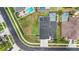 Aerial view of the home displaying a well-manicured lawn and view of other nearby houses at 1741 Beaconsfield Dr, Wesley Chapel, FL 33543