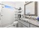 Modern bathroom featuring white subway tile, granite countertops, and a glass shower enclosure at 1741 Beaconsfield Dr, Wesley Chapel, FL 33543
