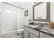 Well lit bathroom featuring a shower-tub combo with white tiling and a granite countertop vanity at 1741 Beaconsfield Dr, Wesley Chapel, FL 33543