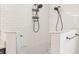 Modern bathroom featuring a dual head shower with marble accents and white subway tile at 1741 Beaconsfield Dr, Wesley Chapel, FL 33543
