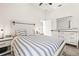 Bright bedroom with ample natural light, wood look floors, ceiling fan, and stylish furniture at 1741 Beaconsfield Dr, Wesley Chapel, FL 33543
