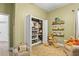 Charming Bedroom with a closet with ample storage, a comfortable armchair and whimsical decor at 1741 Beaconsfield Dr, Wesley Chapel, FL 33543