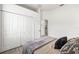 Comfortable bedroom features large closet and neutral decor, creating a serene and inviting atmosphere at 1741 Beaconsfield Dr, Wesley Chapel, FL 33543