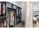 Walk-in closet with custom shelving, providing ample storage and organization space at 1741 Beaconsfield Dr, Wesley Chapel, FL 33543
