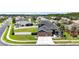 View of the front exterior of the house with an attached two car garage and green landscaping at 1741 Beaconsfield Dr, Wesley Chapel, FL 33543