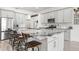 Spacious kitchen with white cabinets, granite countertops, a center island, and stainless steel appliances at 1741 Beaconsfield Dr, Wesley Chapel, FL 33543