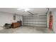 Spacious two car garage offering ample room for parking and storage at 1808 Sawhorse Ct, Lutz, FL 33559
