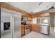 Kitchen featuring stainless steel appliances, wooden cabinets, and tile flooring at 1808 Sawhorse Ct, Lutz, FL 33559