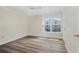 Bedroom with neutral walls, ceiling fan and wood-look flooring at 18533 Bridle Club Dr # 18533, Tampa, FL 33647