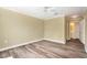 Bedroom with wood-look floors and an ensuite bathroom at 18533 Bridle Club Dr # 18533, Tampa, FL 33647