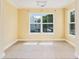 Bright dining area with large windows and tile flooring, creating a sunny atmosphere for meals at 18533 Bridle Club Dr # 18533, Tampa, FL 33647