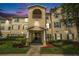 Charming condo building with lush landscaping and a private balcony offers serene outdoor living at 18533 Bridle Club Dr # 18533, Tampa, FL 33647