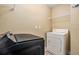 Laundry room with new washer and dryer and wire shelving at 18533 Bridle Club Dr # 18533, Tampa, FL 33647