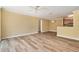 Open-concept living room with wood floors offering seamless transition to dining and kitchen areas at 18533 Bridle Club Dr # 18533, Tampa, FL 33647