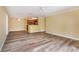 Spacious living room with open floor plan, showcasing updated flooring and abundant natural light at 18533 Bridle Club Dr # 18533, Tampa, FL 33647