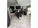 Modern kitchen with stainless steel appliances, dark cabinetry, and center island at 1931 Oak Ridge Ct, Clearwater, FL 33759