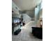 Spacious living room with tall ceilings and a staircase at 1931 Oak Ridge Ct, Clearwater, FL 33759