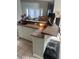 Granite counter top and white cabinets at 1931 Oak Ridge Ct, Clearwater, FL 33759