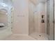 Luxurious walk in shower with glass door and tiled walls at 1936 Floresta View Dr, Tampa, FL 33618
