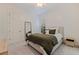 Cozy bedroom with neutral walls, light carpet, and light-blocking shutters at 1936 Floresta View Dr, Tampa, FL 33618