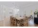Spacious dining area with hardwood floors, bright lighting, and classic decor at 1936 Floresta View Dr, Tampa, FL 33618