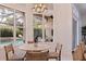 Cozy dining area with view to a screened pool area at 1936 Floresta View Dr, Tampa, FL 33618