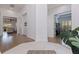 Bright foyer with marble tile accents leads to hardwood floors, office and living spaces at 1936 Floresta View Dr, Tampa, FL 33618