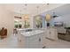 Spacious kitchen island with decorative pendant lighting and open floor plan at 1936 Floresta View Dr, Tampa, FL 33618
