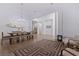 Spacious dining area featuring hardwood floors, bright lighting, and a surfboard at 1936 Floresta View Dr, Tampa, FL 33618
