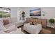 Living room area featuring a modern couch, textured rug, and a large television at 1936 Floresta View Dr, Tampa, FL 33618