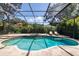 Backyard pool with hot tub and lush landscaping at 1936 Floresta View Dr, Tampa, FL 33618