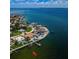 Stunning waterfront homes with private docks on a sunny day with views of the expansive bay area and skyline at 1988 Carolina Ne Cir, St Petersburg, FL 33703