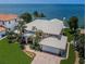Waterfront home featuring a large, well-manicured lawn and private dock access at 1988 Carolina Ne Cir, St Petersburg, FL 33703