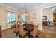 Dining room with hardwood floors, neutral paint, and wicker dining chairs at 1988 Carolina Ne Cir, St Petersburg, FL 33703
