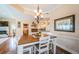 Bright dining area featuring wood floors, a chandelier, and view to the kitchen at 1988 Carolina Ne Cir, St Petersburg, FL 33703