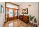 Inviting foyer with decorative double doors, tiled floor, and stylish console table at 1988 Carolina Ne Cir, St Petersburg, FL 33703